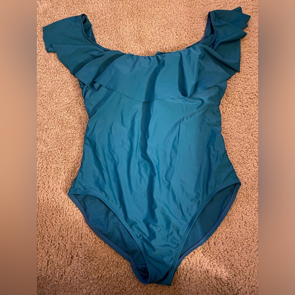 Teal one piece swimsuit with scalloped flutter neckline. Size 16-18